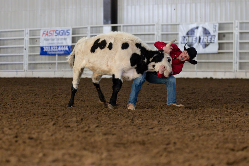 Camden Schultz finds his grip during the steer wrestling competition at the March 11 Winter Rodeo.